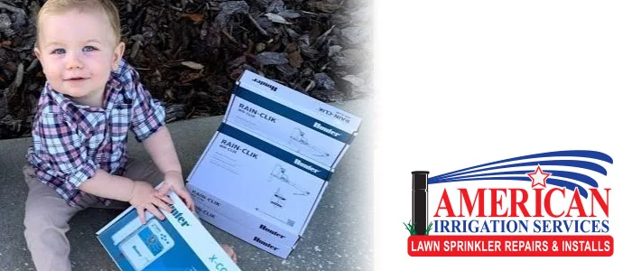 Toddler sitting beside a water treatment equipment box with the American Irrigation Services logo